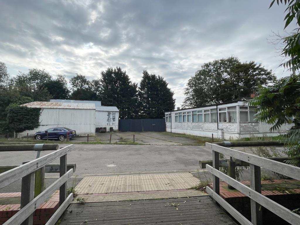 Lot: 133 - COMMERCIAL PROPERTY AND YARD WITH PLANNING - View of 40 Alderford Street taken from entrance to Alderford Mill